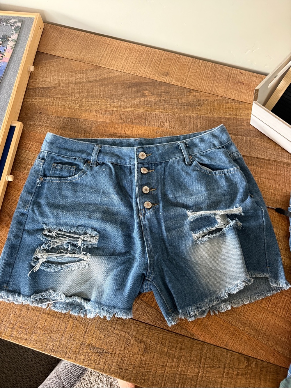 High-Rise Distressed Blue Denim Button-Front Shorts